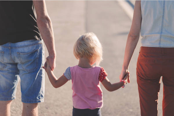 A Family Walking Thier Baby Girl - Estate Planning, Will, and Trust